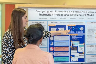 Student presents a poster at CBER symposium